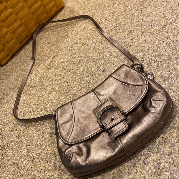 Coach Handbags - Coach Crossbody Leather Small Bag The Color is Possibly a Bronze or a Gold Color